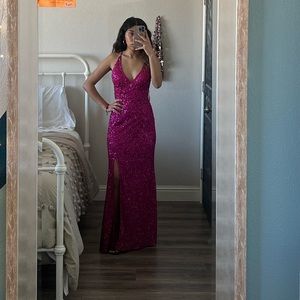 Long pink beaded dress with a low back cut out.